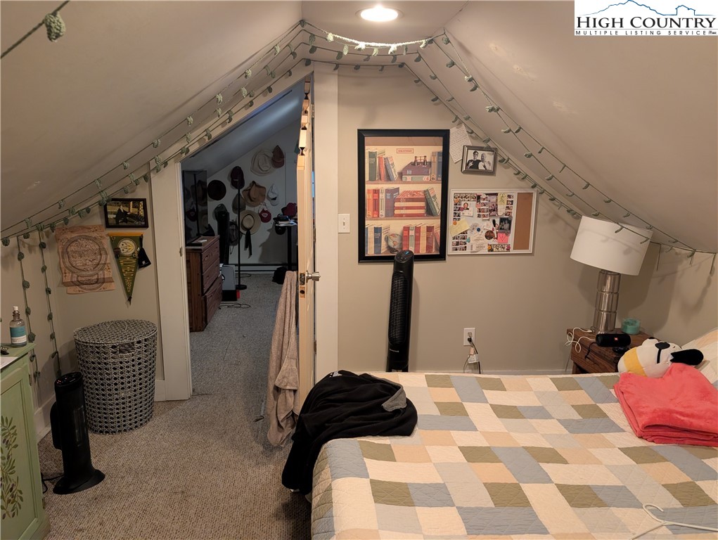 1616 Highway 194 Boone, NC 28607 - Photo 11 of 12 a bedroom with a bed and a walk in closet