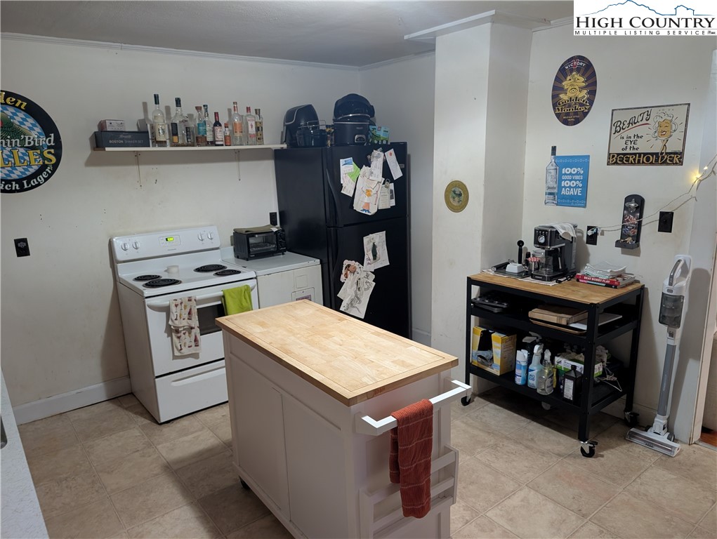 1616 Highway 194 Boone, NC 28607 - Photo 5 of 12 a kitchen with a stove a refrigerator and cabinets