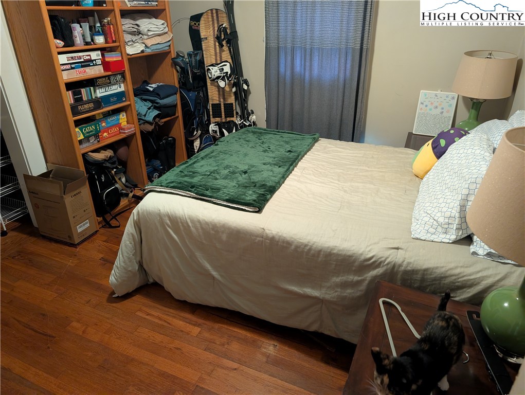 1616 Highway 194 Boone, NC 28607 - Photo 9 of 12 a bedroom with a bed and a book shelf