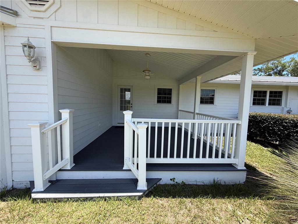 7390 South Mc Alpin Road McAlpin, FL 32062 - Photo 28 of 53 a view of a house with wooden floor and a yard