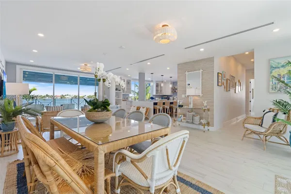 a kitchen that has a lot of cabinets a sink and a wooden floor