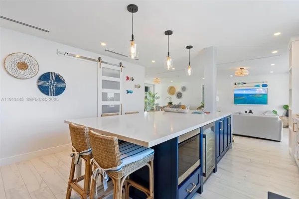a living room with furniture and white walls