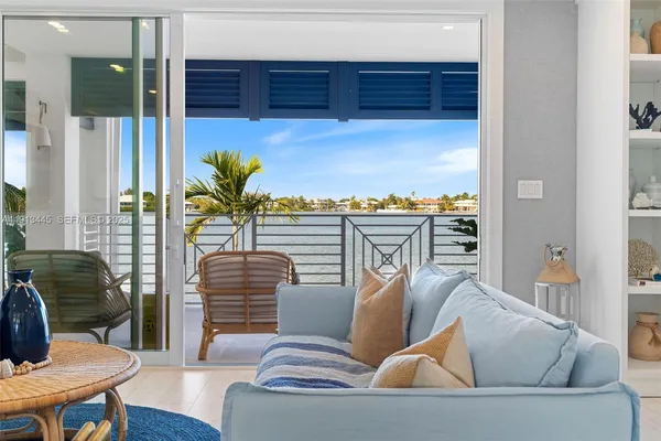 a bedroom with a large bed and a couch