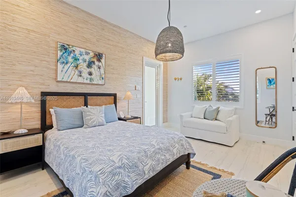 a bedroom with a bed and a mirror