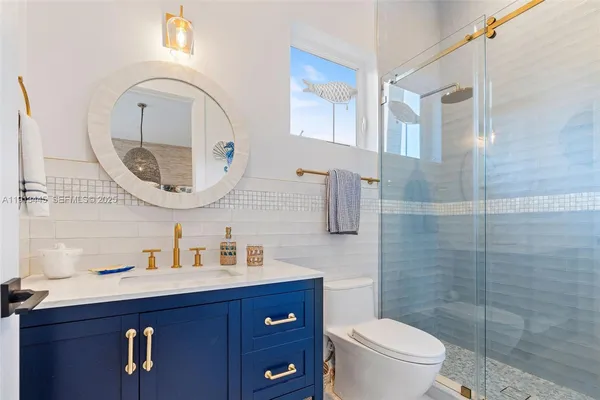 a view of a patio with table and chairs with wooden floor and fence