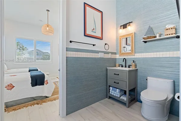 a utility room with sink dryer and washer