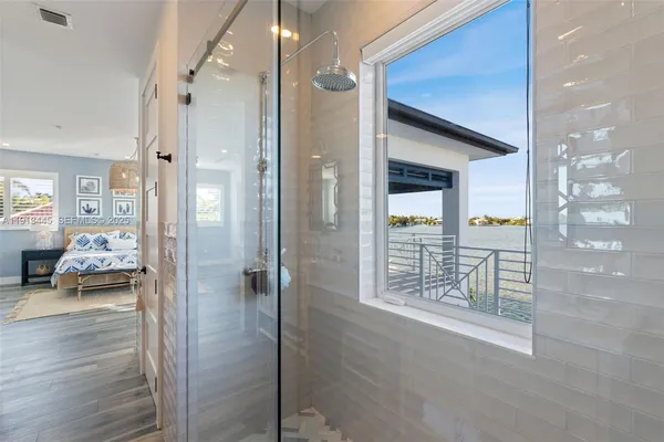 a view of roof deck with seating space and wooden fence