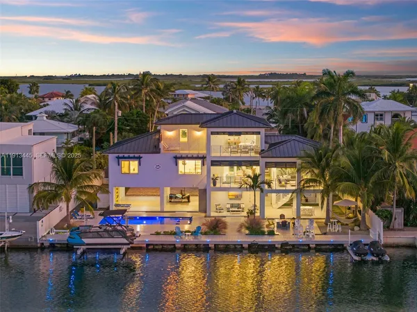 an aerial view of a house with a lake view