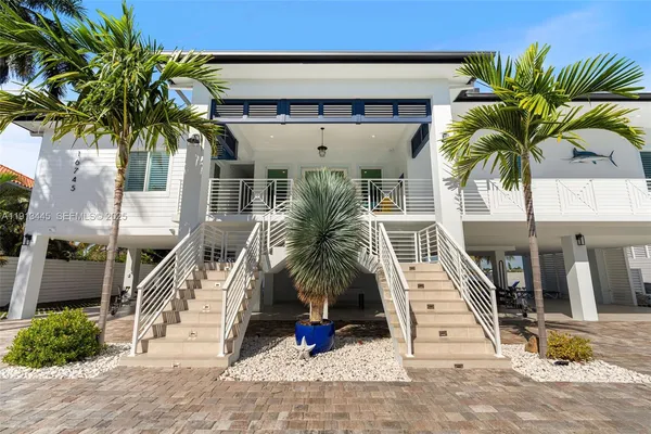 a view of a dining room with furniture and a potted plant