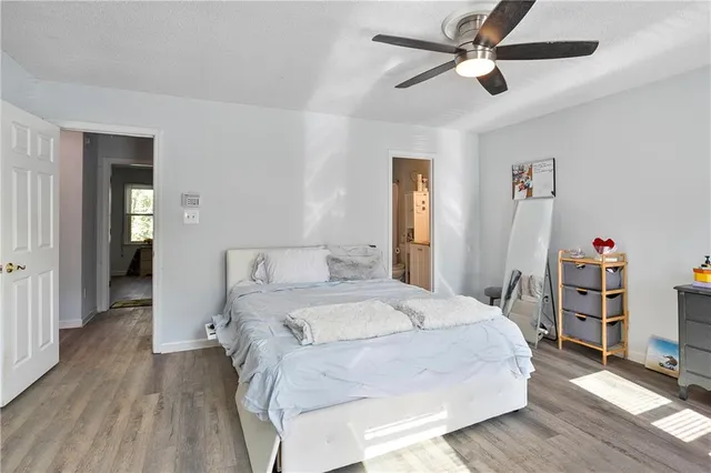 a bedroom with a bed and window