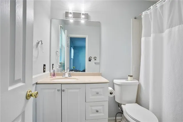 a picture of a bench in front of a building