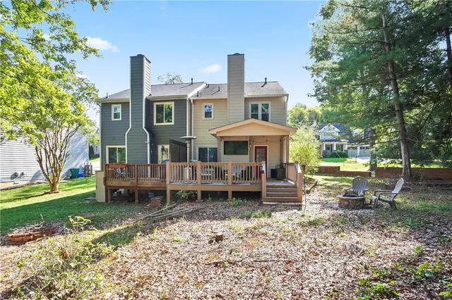 a front view of a house with a yard table and chairs