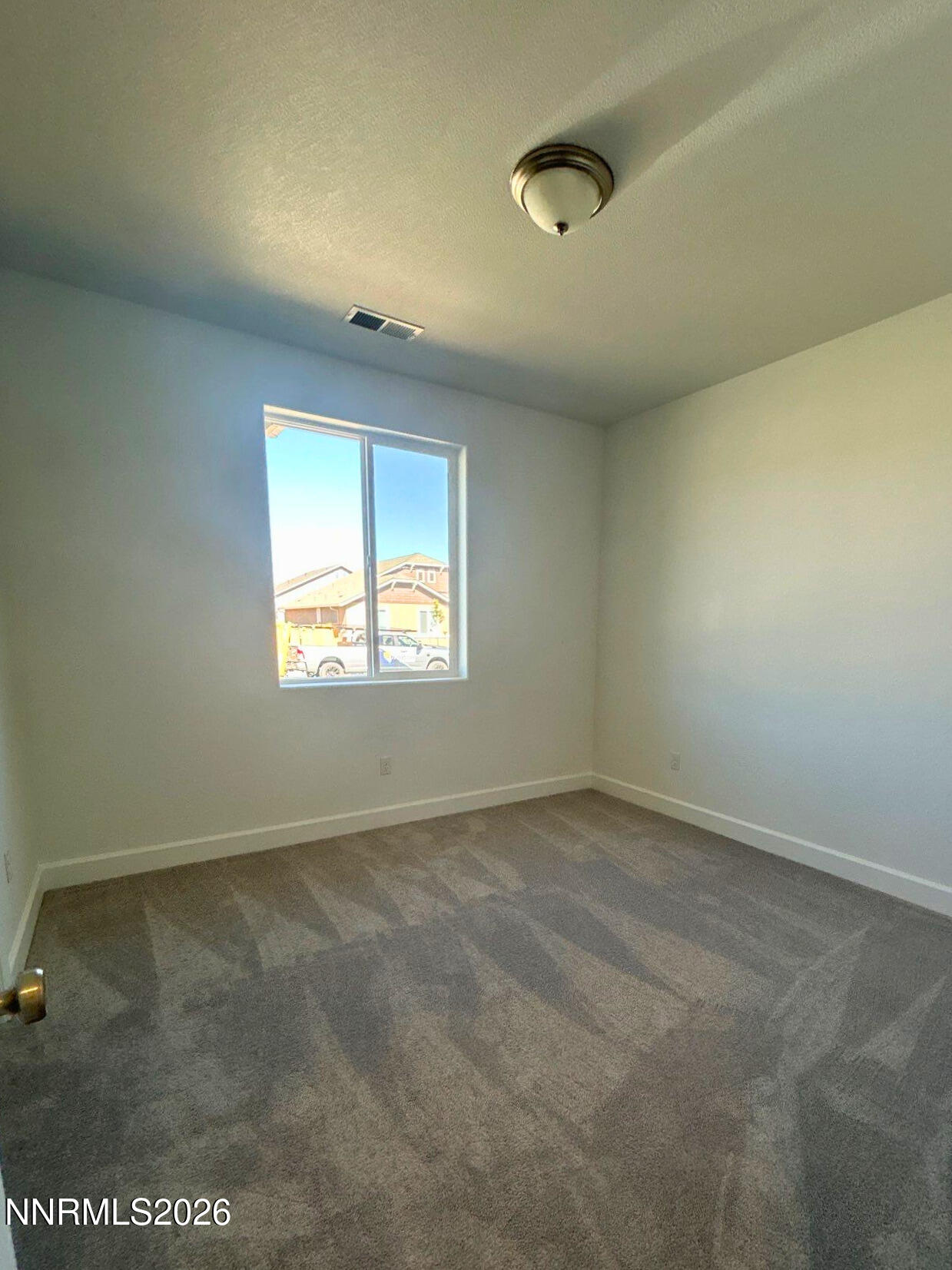 3453 Payton Way Fernley, NV 89408 - Photo 11 of 15 an empty room with a window