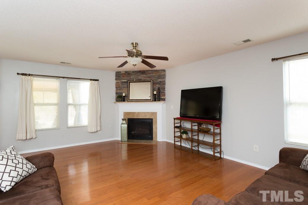 3169 Varcroft Road Knightdale, NC 27545 - Photo 9 of 9 a living room with furniture and a flat screen tv