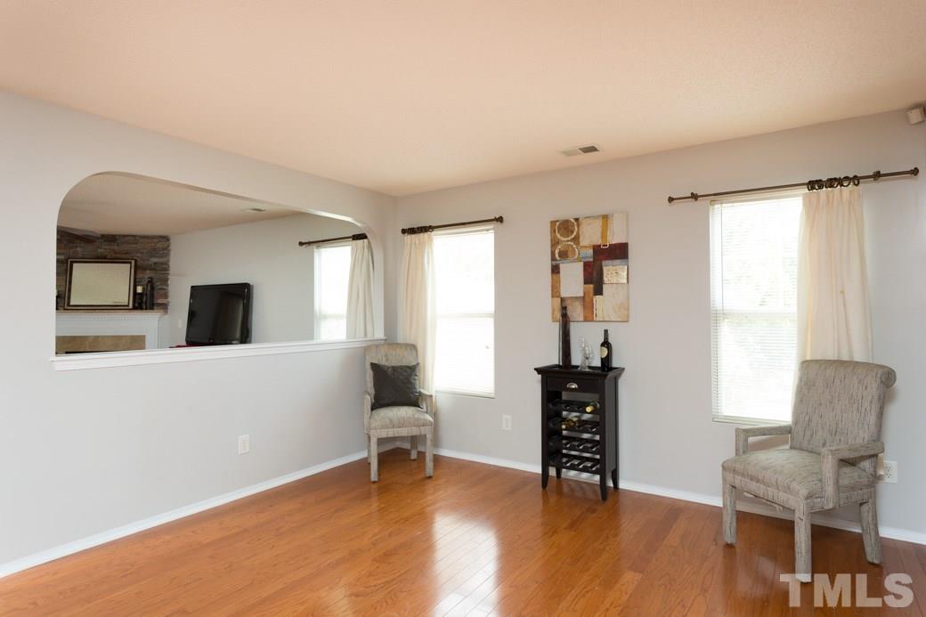 3169 Varcroft Road Knightdale, NC 27545 - Photo 2 of 9 a living room with furniture and wooden floor