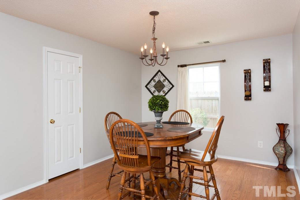 3169 Varcroft Road Knightdale, NC 27545 - Photo 3 of 9 a dining room with furniture and window