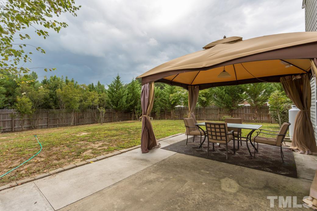 3169 Varcroft Road Knightdale, NC 27545 - Photo 7 of 9 a view of a swimming pool with a patio