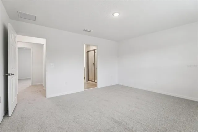 a view of a swimming pool with a yard