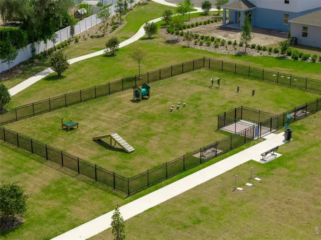 a view of a swimming pool with a yard