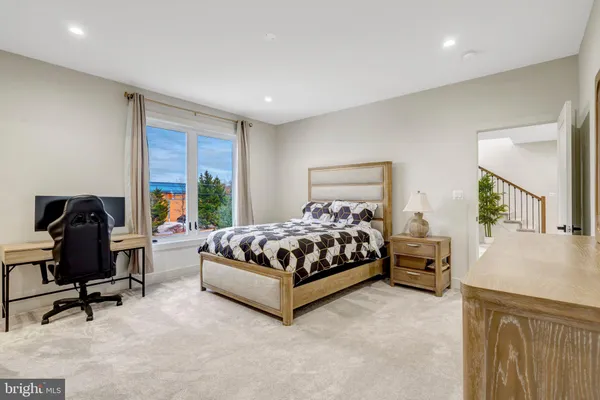 a bedroom with a bed and chair