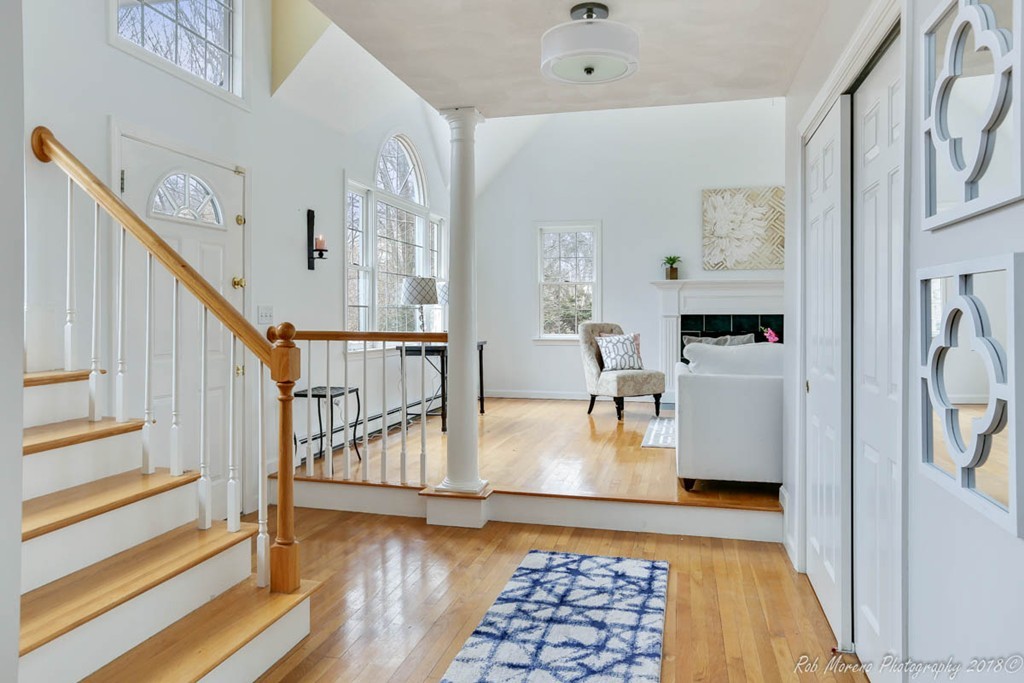 a view of living room with furniture and rug