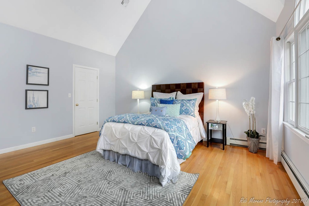 295 South Main Street Andover, MA 01810 - Photo 21 of 30 a bed room with a bed and wooden floor