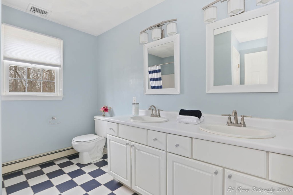 295 South Main Street Andover, MA 01810 - Photo 25 of 30 a bathroom with a sink toilet and mirror