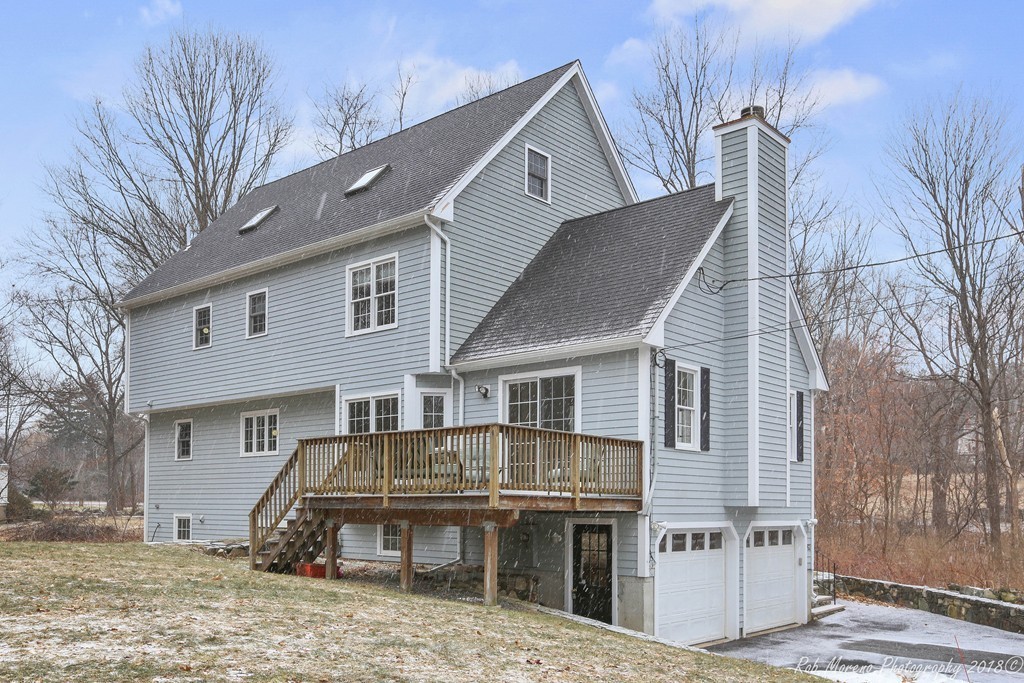 295 South Main Street Andover, MA 01810 - Photo 27 of 30 front view of a house with a bench