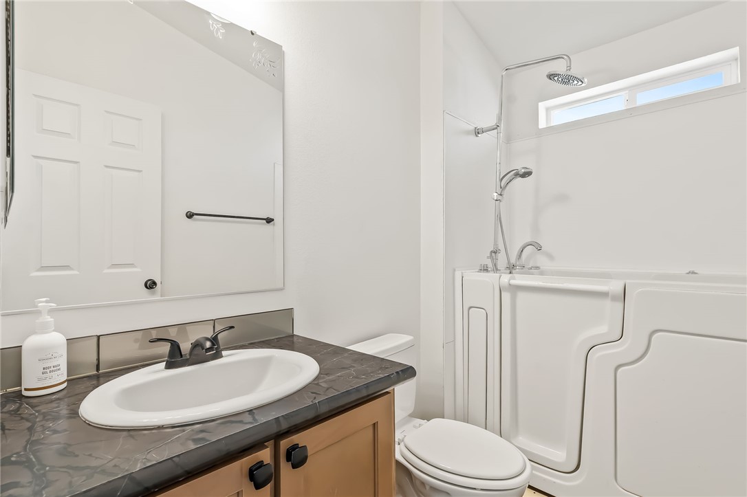 3534 Eloy Road Golden Valley, AZ 86413 - Photo 25 of 58 Bathroom with vanity and shower / tub combination