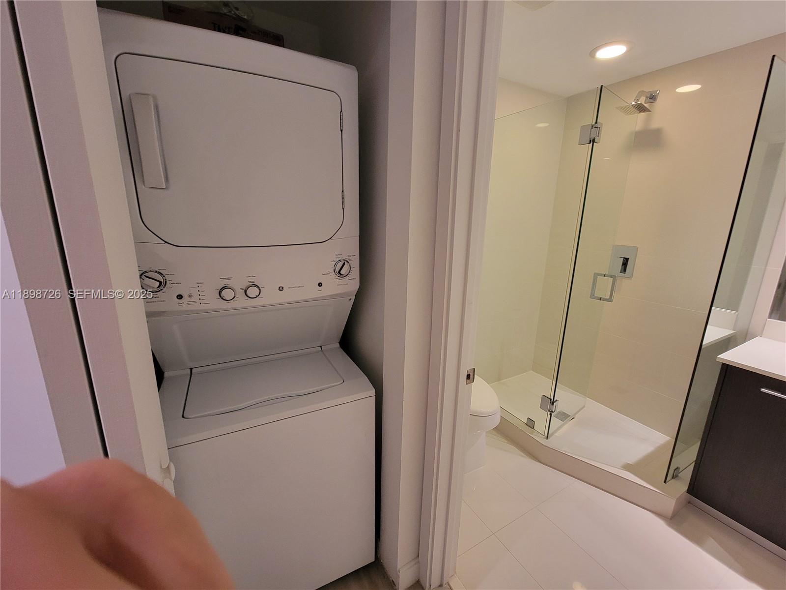 45 Southwest 9th Street, Unit 3404 Miami, FL 33130 - Photo 25 of 25 a utility room with dryer and washer