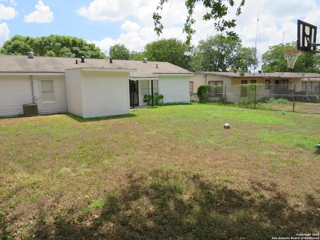a backyard of a house with a lake view