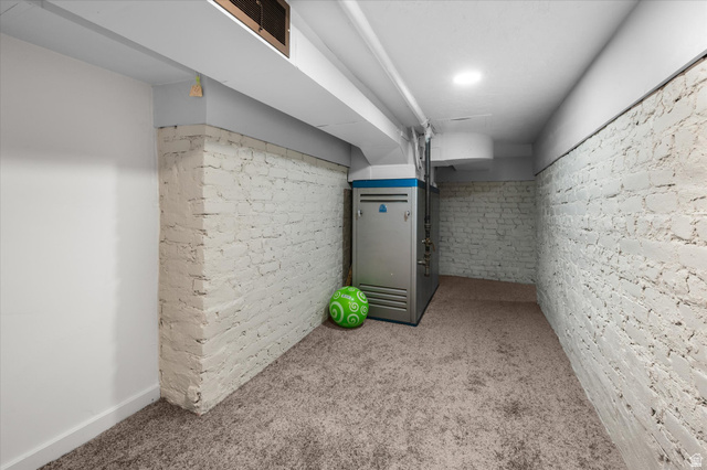 327 35th Street Ogden, UT 84401 - Photo 27 of 31 Basement utility space featuring painted brick walls, recessed ceiling lighting, and a neutral carpeted floor