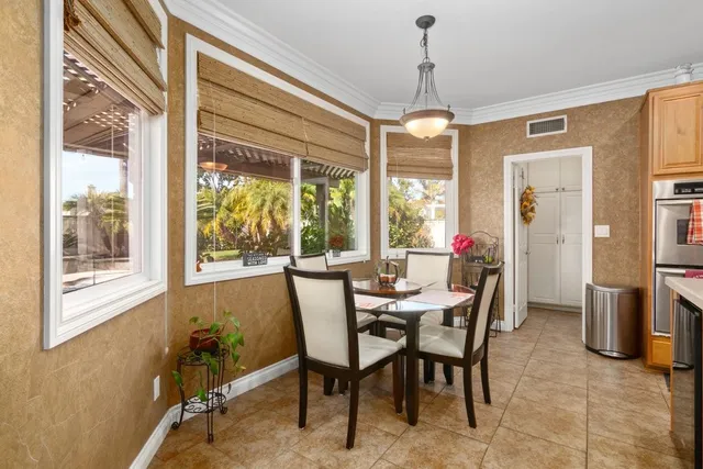 a view of a dining room with furniture window and outside view