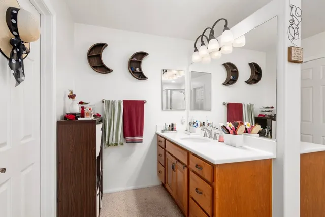 a bathroom with a sink and a mirror