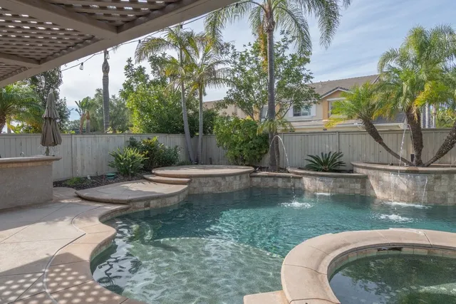a view of a swimming pool with a patio
