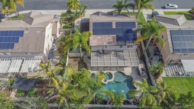 a aerial view of a house with a yard and garden