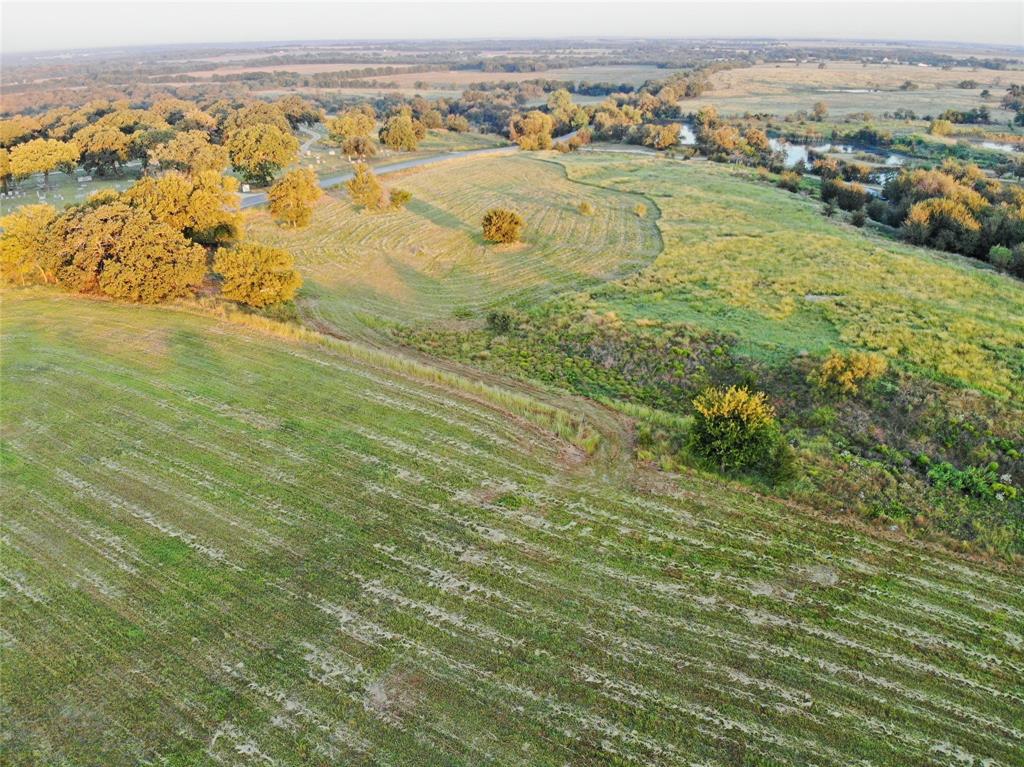 434 4 Corners Road West, TX 76691 - Photo 4 of 6 an aerial view of residential houses with outdoor space