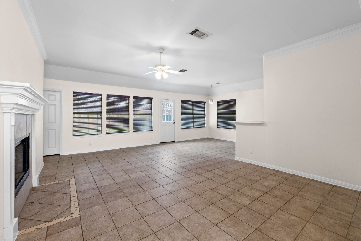 Undisclosed Address Austin, TX 78721 - Photo 2 of 17 a view of a livingroom with an empty space and a fireplace