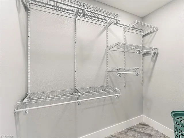 a view of a room with racks on the wall