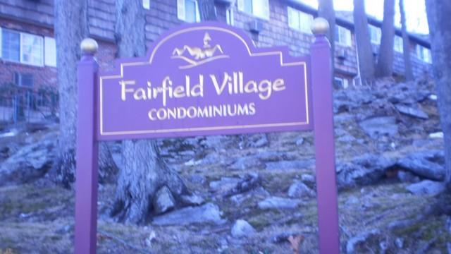 a sign that is on a brick wall