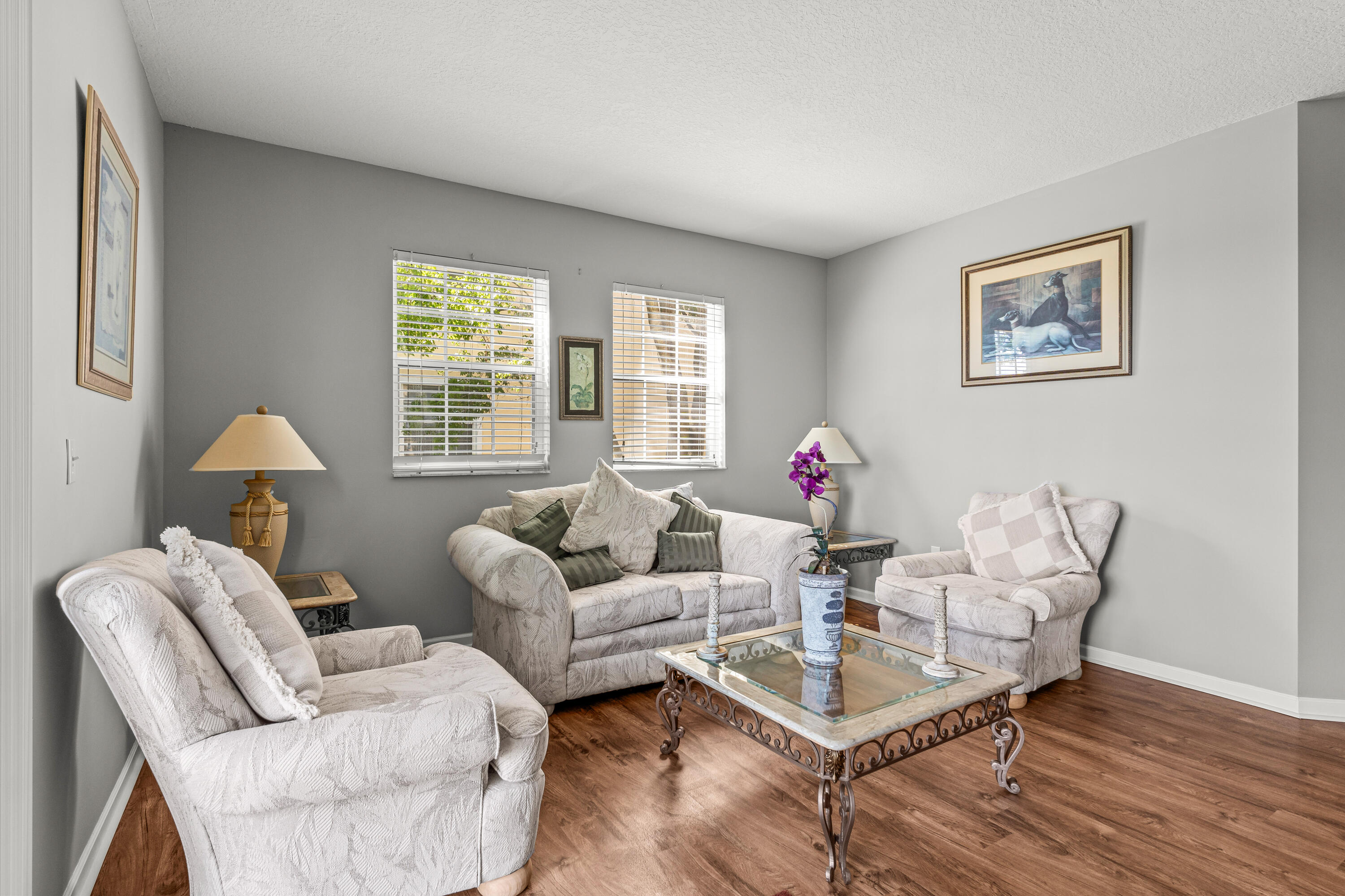 1951 Brandywine Road, Unit 59303 West Palm Beach, FL 33409 - Photo 5 of 25 a living room with furniture a table and a window