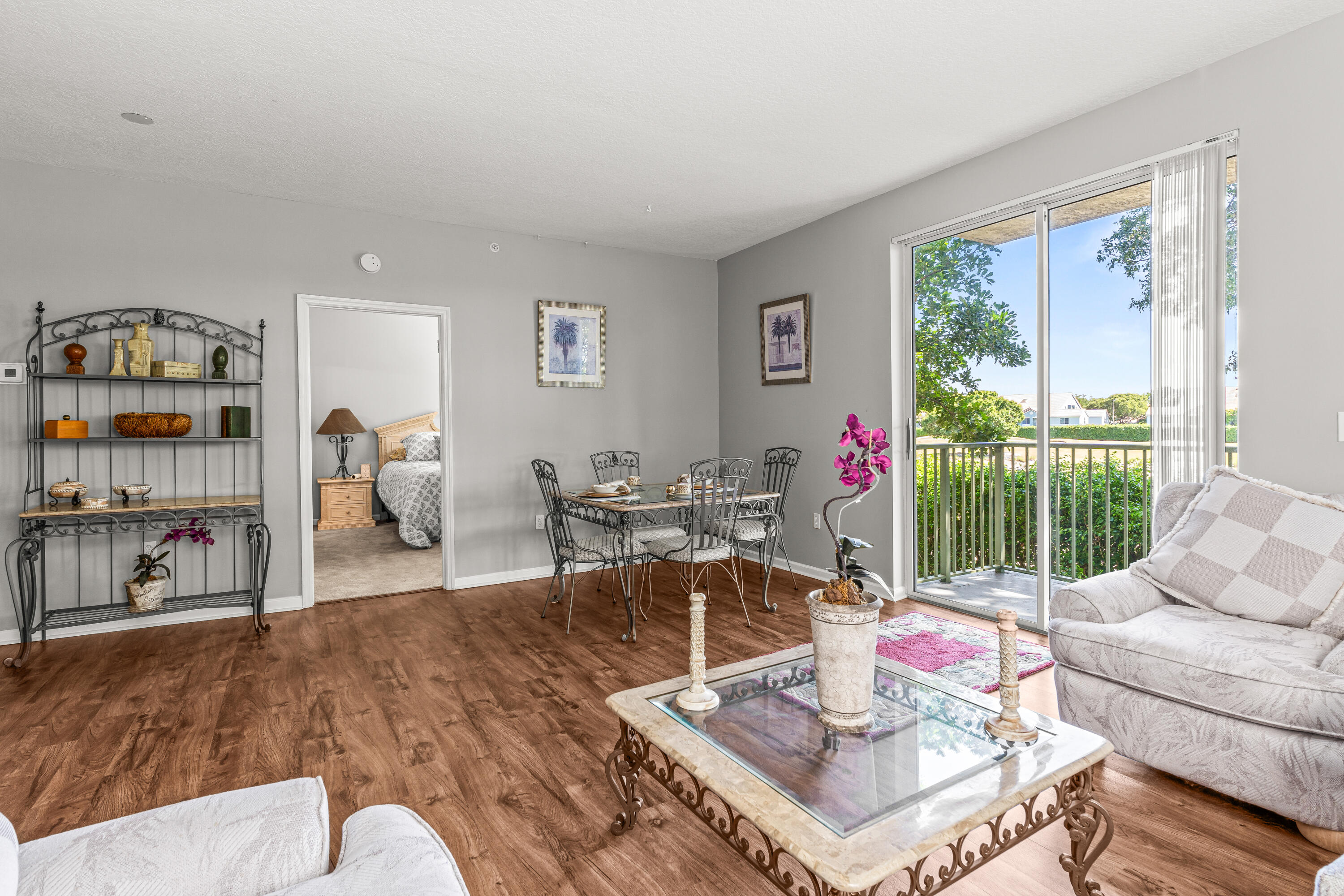 1951 Brandywine Road, Unit 59303 West Palm Beach, FL 33409 - Photo 7 of 25 a living room with furniture and a large window