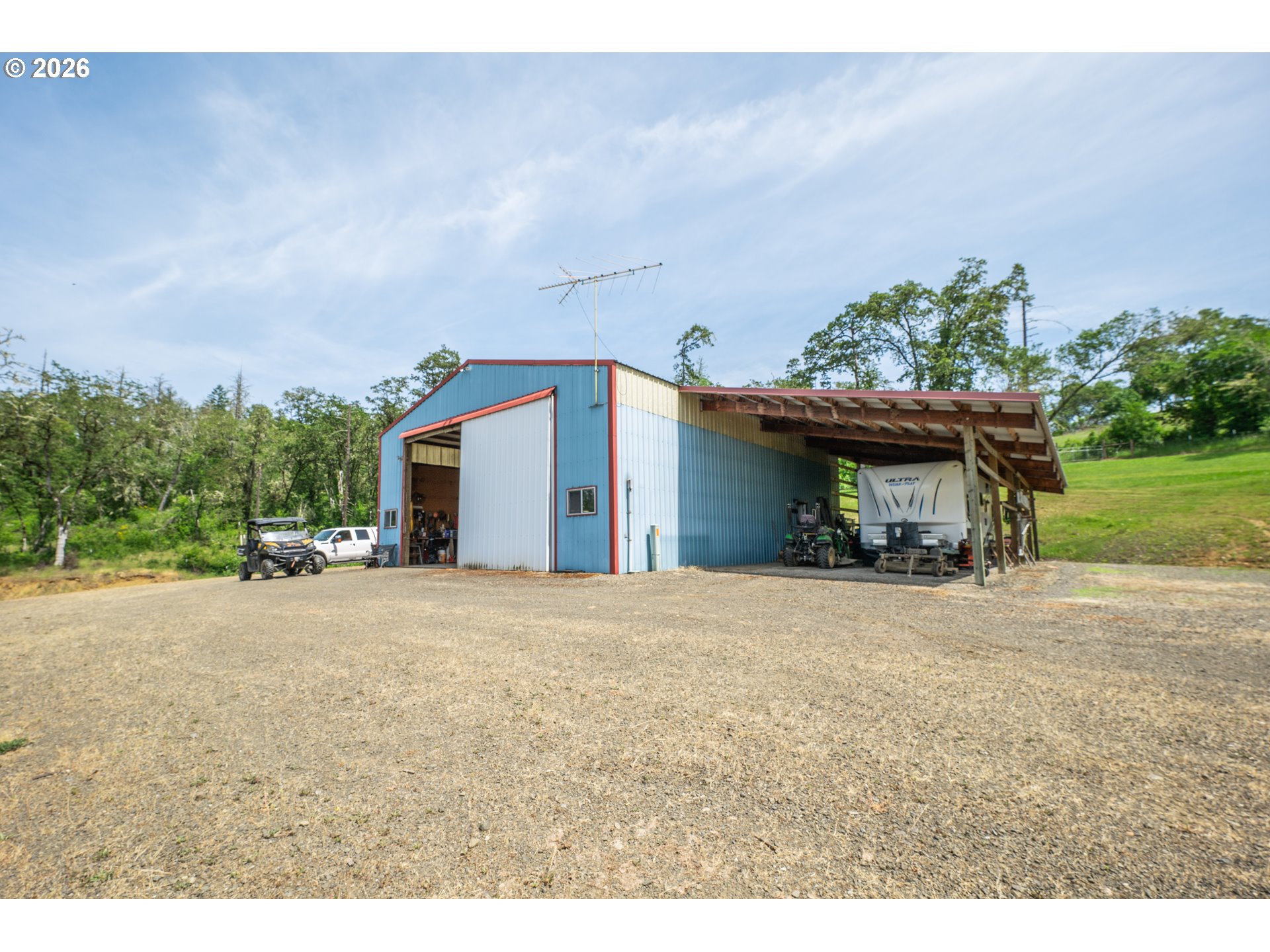 489 Fir Vista Road Sutherlin, OR 97479 - Photo 39 of 47 a view of a house with a yard and garage