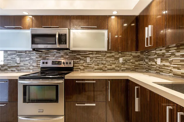 a kitchen with a stove and a refrigerator