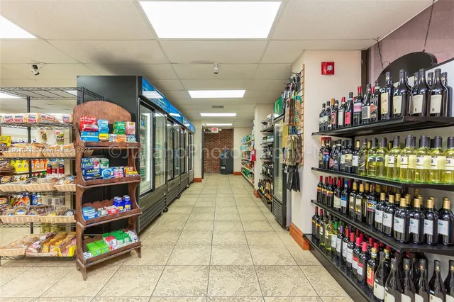 a view of walk in closet with clothes