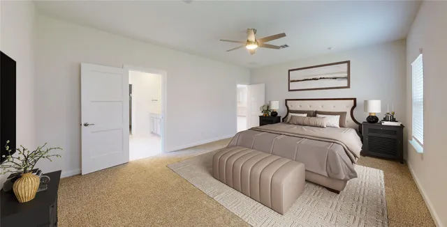 a bedroom with a bed and painting on the wall