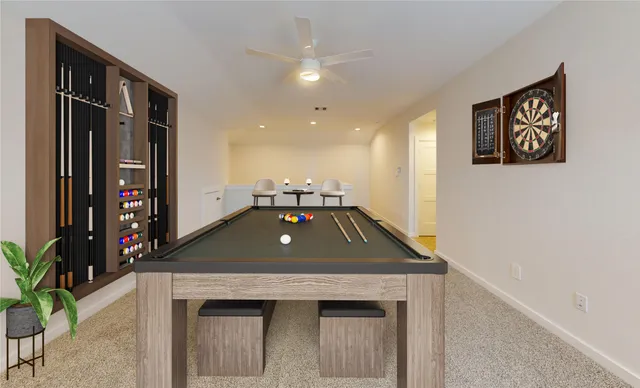 a room with pool table and windows