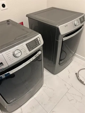 a utility room with washer and dryer