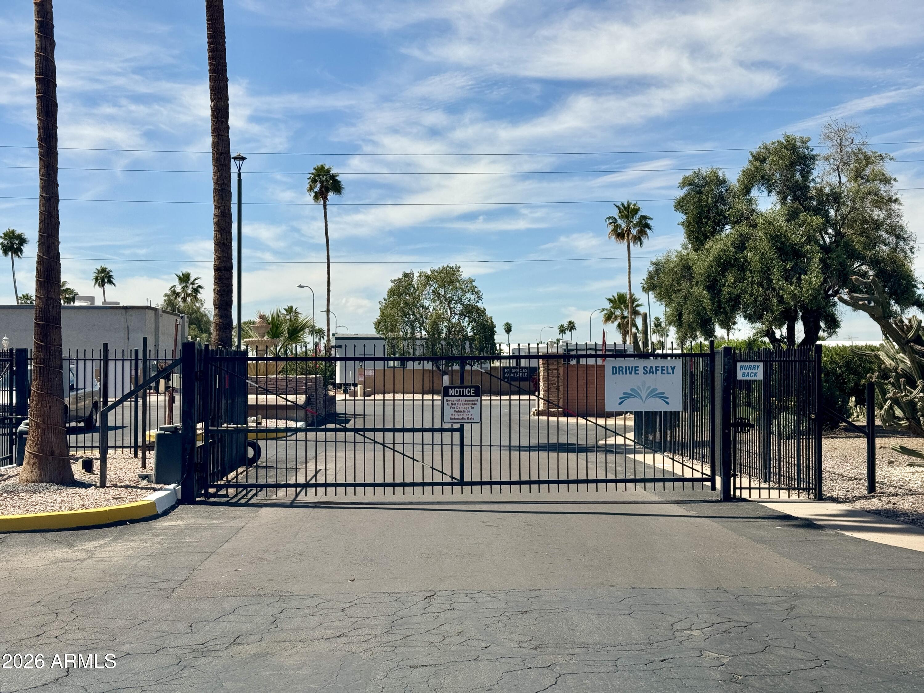 303 South Recker Road, Unit 16 Mesa, AZ 85206 - Photo 11 of 23 a view of a street with fence