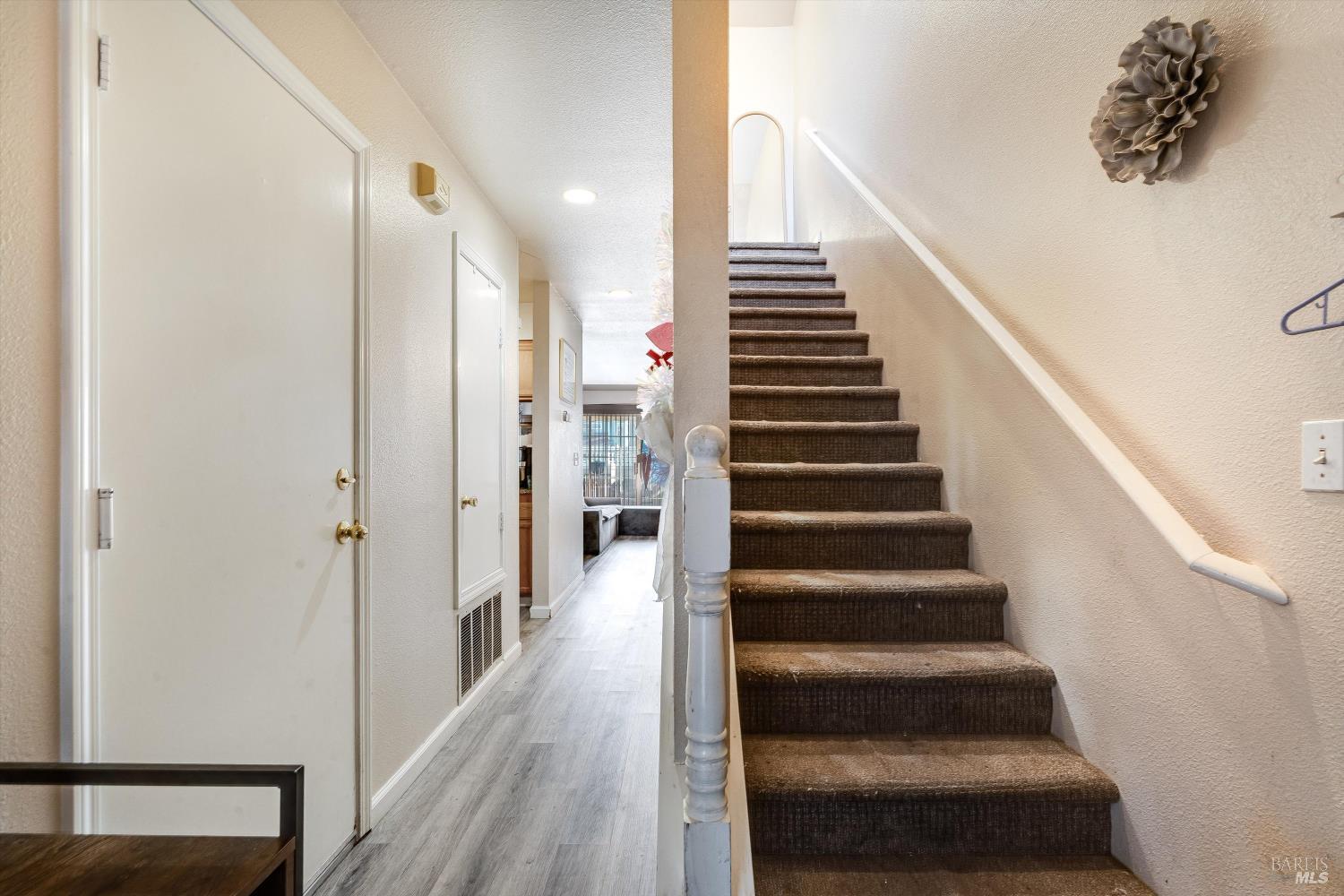 590 Laurel Grove Circle Santa Rosa, CA 95407 - Photo 22 of 44 a view of entryway and gallery with wooden floor